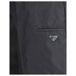 Black Recycled Polyamide Bermuda ShortsThe Re-Nylon Bermuda Shorts by Prada merge contemporary design with a sustainable ethos. Crafted from ECONYL®, a regenerated nylon yarn produced from recycled ocean plastics, fishing nets, and textile fibers, they em