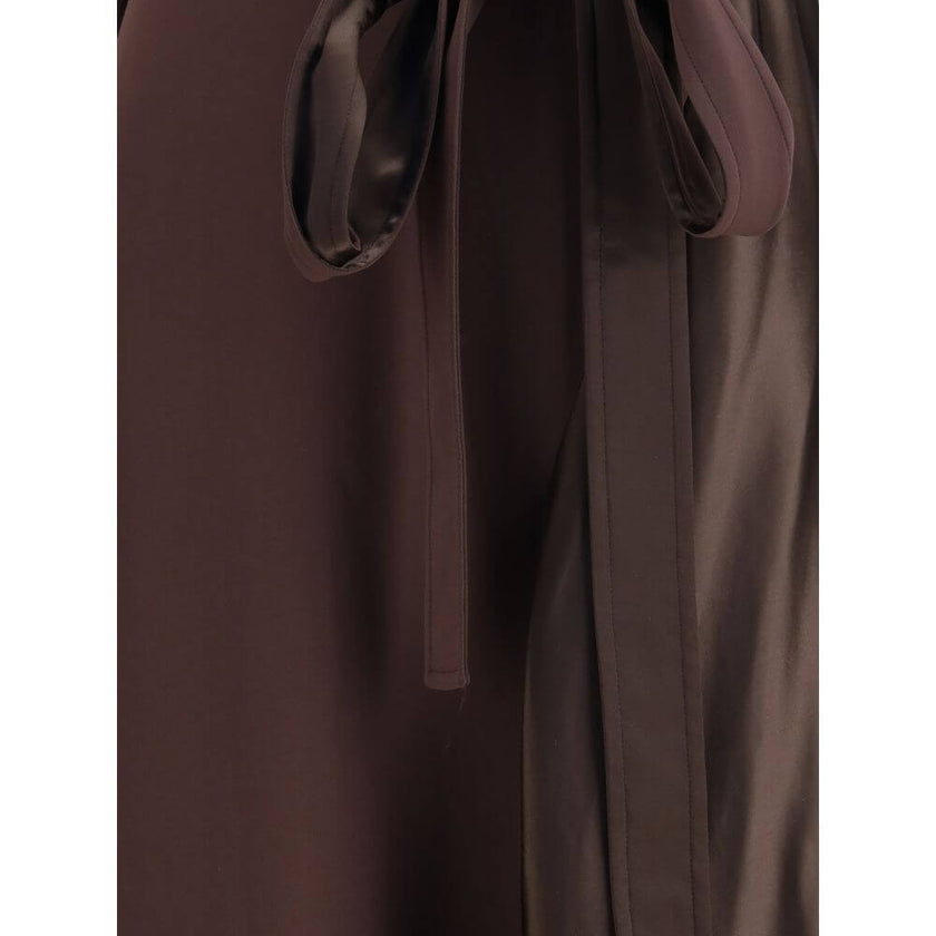 Brown Viscose Cocktail DressThe asymmetric Dress crafted from stretch viscose cady, enhanced by satin side panels that create a refined textural contrast. The draped cowl neckline softens the silhouette, while the waist is accentuated by a sash threaded t