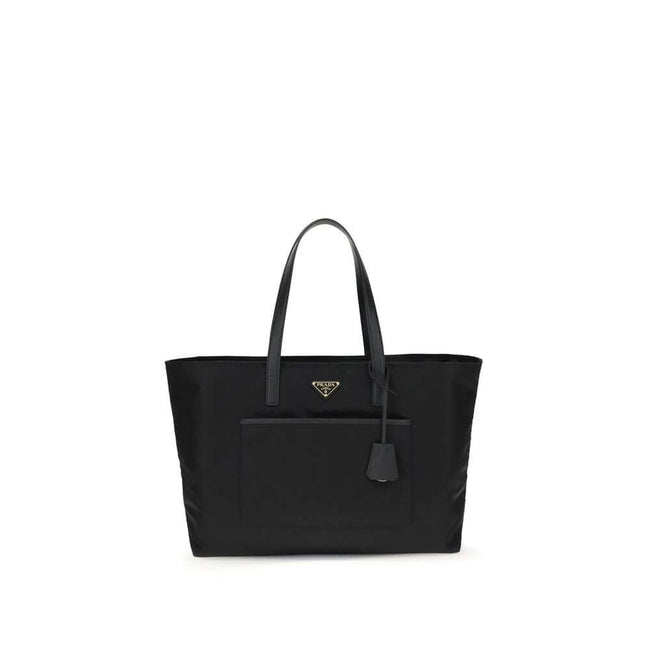 Black Nylon Shoulder BagRe-Nylon Re-Edition 1978 Shoulder Bag by Prada, two flat handles, concealed top zipper closure, interior lining with printed logo, front panel patch pocket, iconic triangular enameled signature brand plaque applied to front. Season