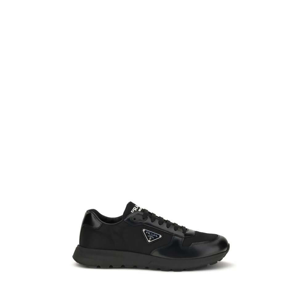 Black Recycled Polyamide Athletic SneakersPrax 01 Sneakers by Prada, made of Re-Nylon and brushed leather, combine contemporary style and innovative materials. Equipped with laces, they feature an enameled triangle logo on the upper and screen-printed Pra