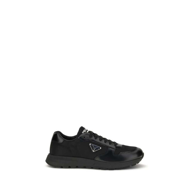 Black Recycled Polyamide Athletic SneakersPrax 01 Sneakers by Prada, made of Re-Nylon and brushed leather, combine contemporary style and innovative materials. Equipped with laces, they feature an enameled triangle logo on the upper and screen-printed Pra