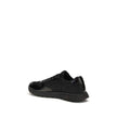 Black Recycled Polyamide Athletic SneakersPrax 01 Sneakers by Prada, made of Re-Nylon and brushed leather, combine contemporary style and innovative materials. Equipped with laces, they feature an enameled triangle logo on the upper and screen-printed Pra
