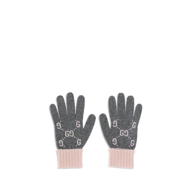 Cashmere GG GlovesCashmere GG Gloves by Gucci feature a five-finger design and contrasting ribbed elastic cuff. The all-over print GG motif adds a distinctive and refined touch to this stylish and comfortable accessory. Season: AW25 Composition: GENERAL 1