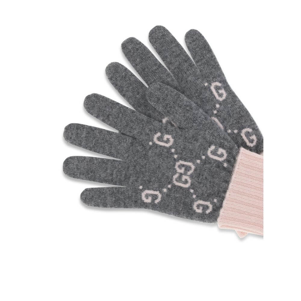 Cashmere GG GlovesCashmere GG Gloves by Gucci feature a five-finger design and contrasting ribbed elastic cuff. The all-over print GG motif adds a distinctive and refined touch to this stylish and comfortable accessory. Season: AW25 Composition: GENERAL 1