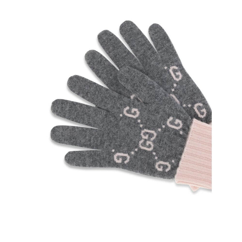 Cashmere GG GlovesCashmere GG Gloves by Gucci feature a five-finger design and contrasting ribbed elastic cuff. The all-over print GG motif adds a distinctive and refined touch to this stylish and comfortable accessory. Season: AW25 Composition: GENERAL 1