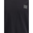 Black Cotton T-ShirtThe Stone Island crew-neck T-shirt elevates a wardrobe essential with the brand’s signature approach. Crafted from cotton crêpe jersey, it features a garment-dyed finish, giving each piece unique depth of color. Designed with a slim fi