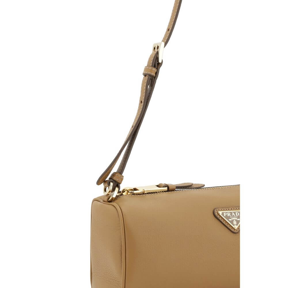 Beige Calf Leather Bos Taurus Shoulder BagPrada’s Leather Shoulder Bag is an elegant and versatile accessory, ideal for completing any look with a touch of understated luxury. The grained leather design lends a refined and durable texture, while the adjus