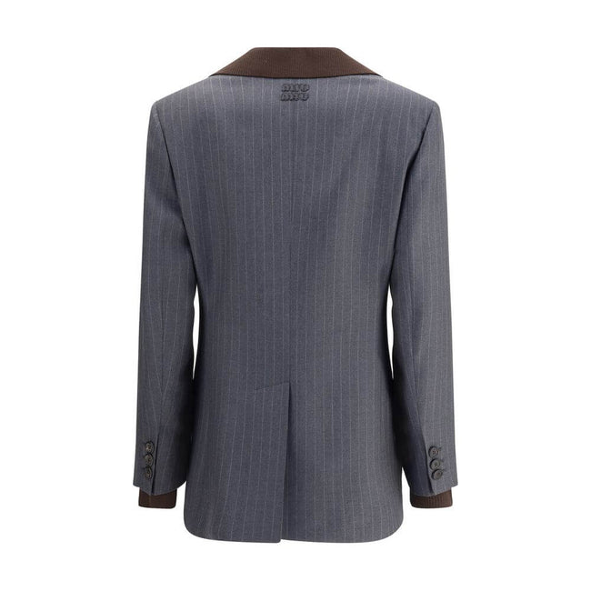 Gray Fleece Wool BlazerMiu Miu’s striped Blazer combines classic elegance with contemporary details. The single-breasted design features two welt flap pockets, a breast pocket and peaked lapels, while the ribbed collar and double sleeves add a touch of or