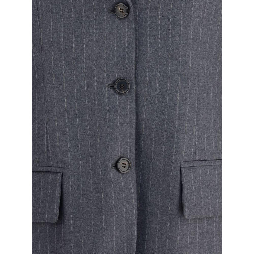Gray Fleece Wool BlazerMiu Miu’s striped Blazer combines classic elegance with contemporary details. The single-breasted design features two welt flap pockets, a breast pocket and peaked lapels, while the ribbed collar and double sleeves add a touch of or