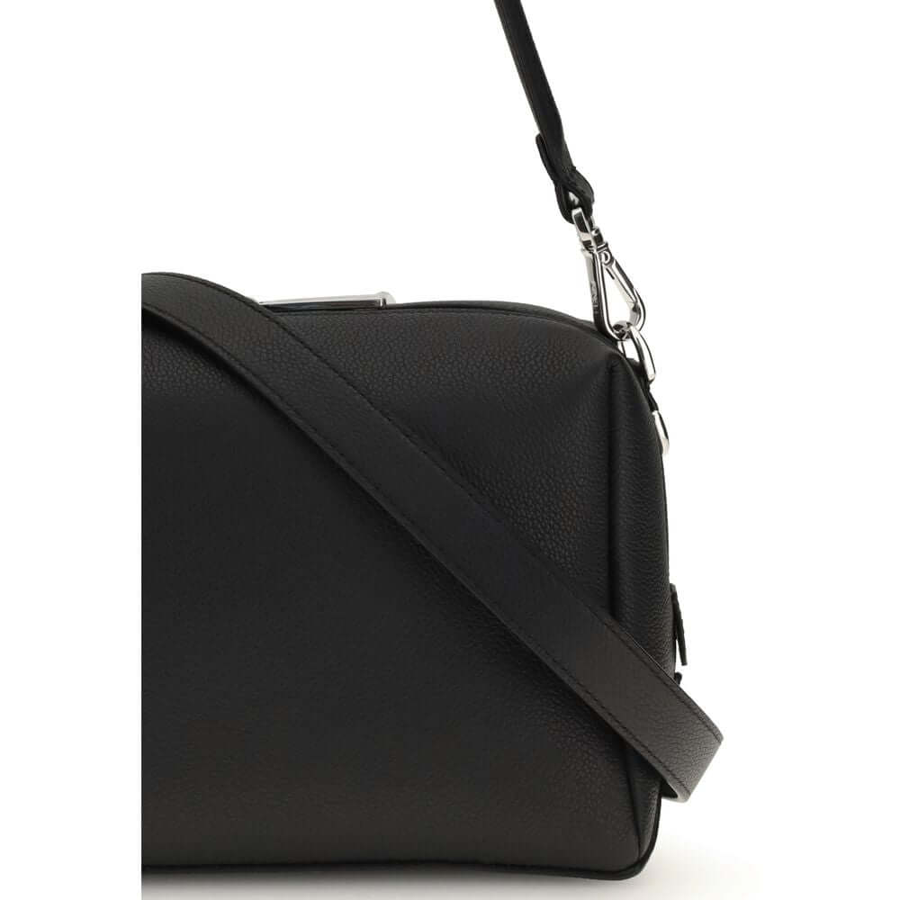 Black Calf Leather Bos Taurus Shoulder BagThe Lui Bag by Fendi features a soft, structured design with a clean, contemporary aesthetic. Crafted from black grained calf leather, it’s enhanced by a long double-slider zip and signature FF metal accents on th