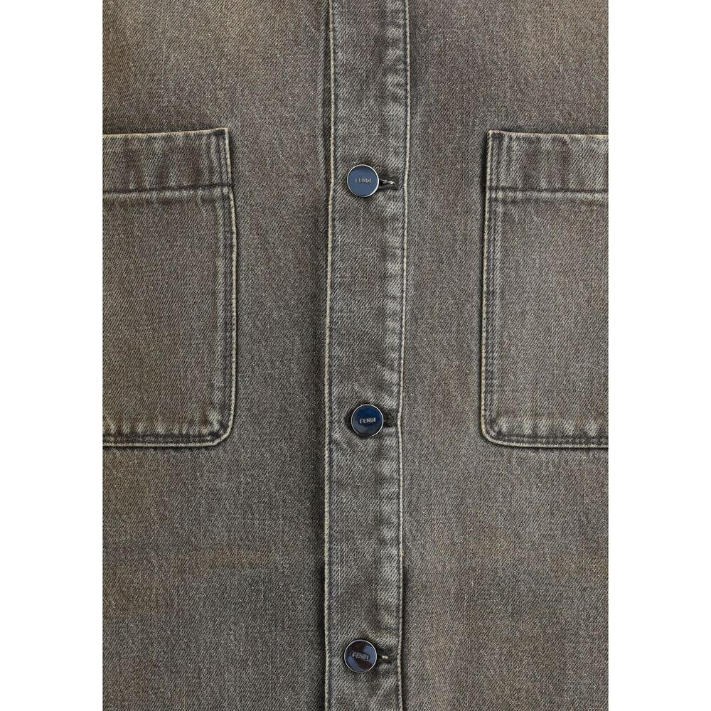 Gray Denim ShirtThe overdyed Denim Shirt by Fendi embodies a bold, contemporary spirit. Designed with dropped shoulders and chest patch pockets, it balances casual ease with refined craftsmanship. The front is fastened with logo-engraved metal buttons, ad