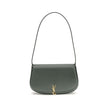 Green Calf Leather Bos Taurus Shoulder BagThe Voltaire mini Shoulder Bag by Saint Laurent is an elegant crescent-shaped bag crafted from calfskin with a lightly polished finish. Bronze-colored metallic parts add a warm, vintage touch, while the Cassandre