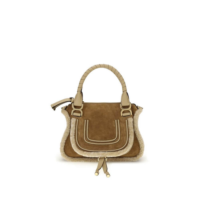 Beige Leather HandbagMarcie small Handbag by Chloé, made of suede and shearling leather, is a perfect balance of elegance and functionality. It can be carried by hand, over the shoulder or over the shoulder thanks to the removable leather strap via hooks.