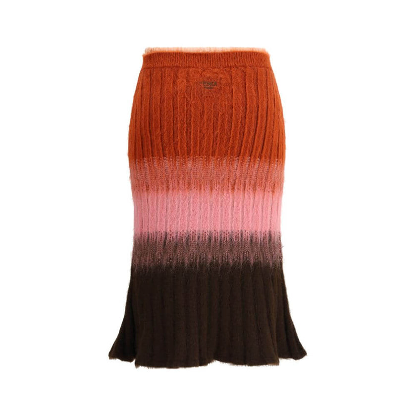 Multicolor Mohair Midi SkirtThe Mohair and Wool Midi Skirt elegantly embodies Fendi’s artisanal tradition and refined aesthetic. The high waist and fitted silhouette, slightly flared at the hem, define a feminine and balanced shape. Crafted in ribbed vani