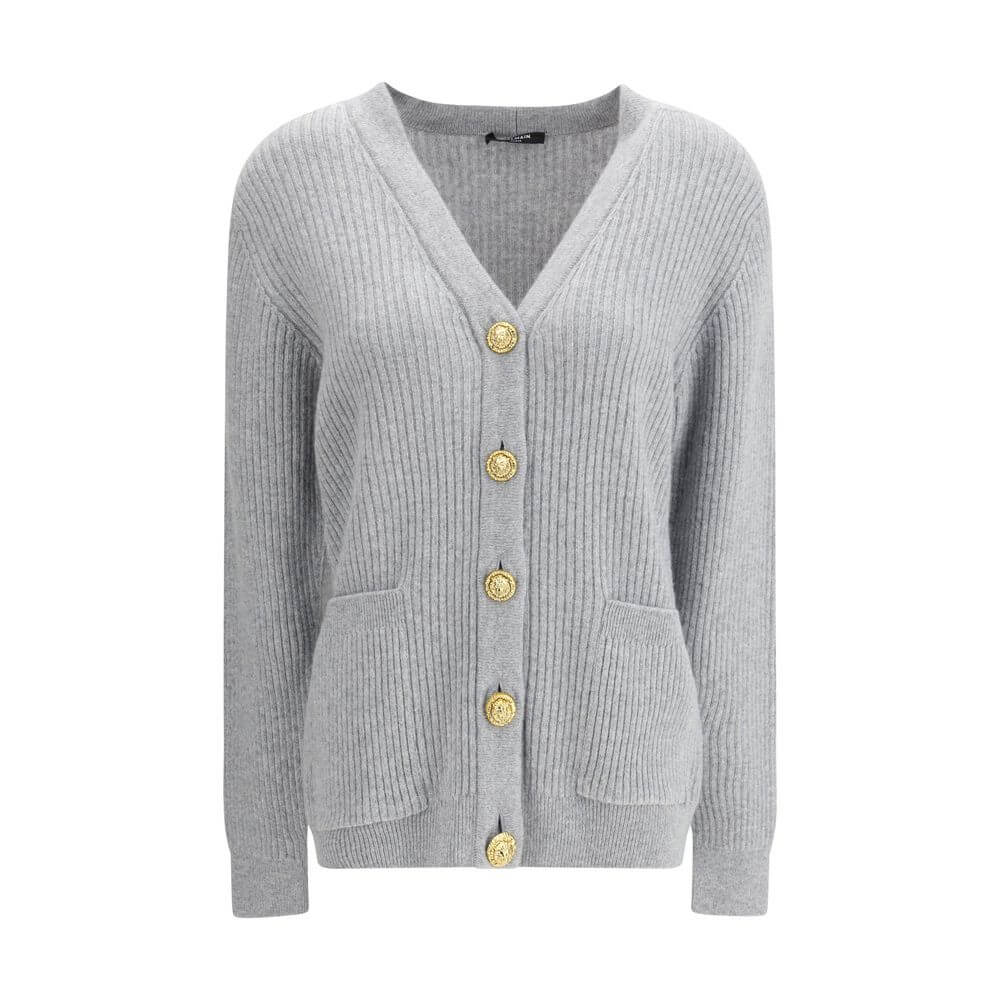 Gray Fleece Wool CardiganThe long cashmere Cardigan by Balmain represents the perfect fusion of comfort and sophistication, typical of the brand. The soft, elongated line is defined by the deep V-neckline and ribbed edges that emphasize its structure with