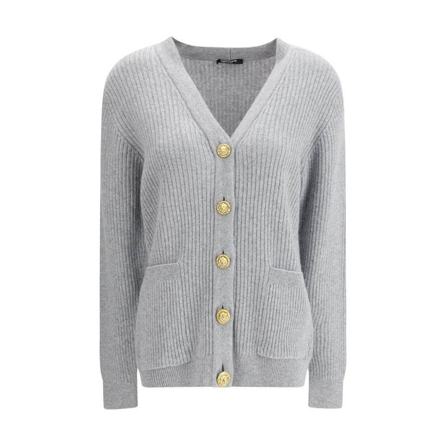 Gray Fleece Wool CardiganThe long cashmere Cardigan by Balmain represents the perfect fusion of comfort and sophistication, typical of the brand. The soft, elongated line is defined by the deep V-neckline and ribbed edges that emphasize its structure with