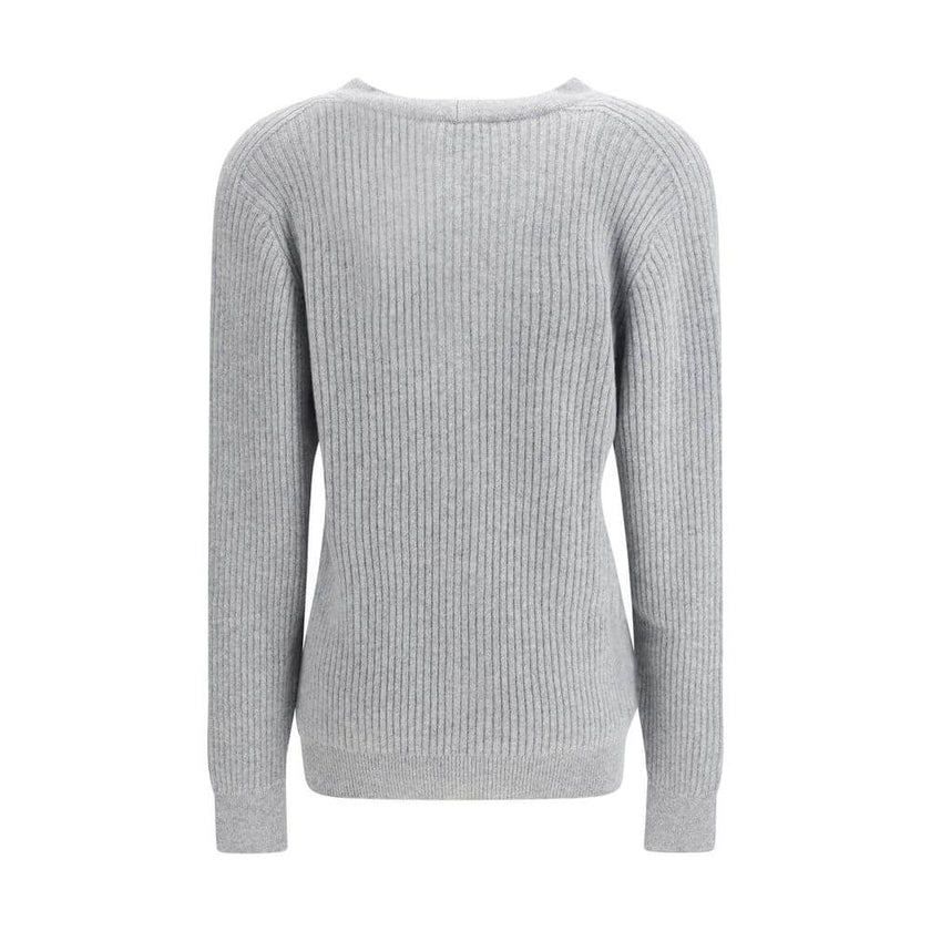 Gray Fleece Wool CardiganThe long cashmere Cardigan by Balmain represents the perfect fusion of comfort and sophistication, typical of the brand. The soft, elongated line is defined by the deep V-neckline and ribbed edges that emphasize its structure with