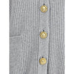 Gray Fleece Wool CardiganThe long cashmere Cardigan by Balmain represents the perfect fusion of comfort and sophistication, typical of the brand. The soft, elongated line is defined by the deep V-neckline and ribbed edges that emphasize its structure with