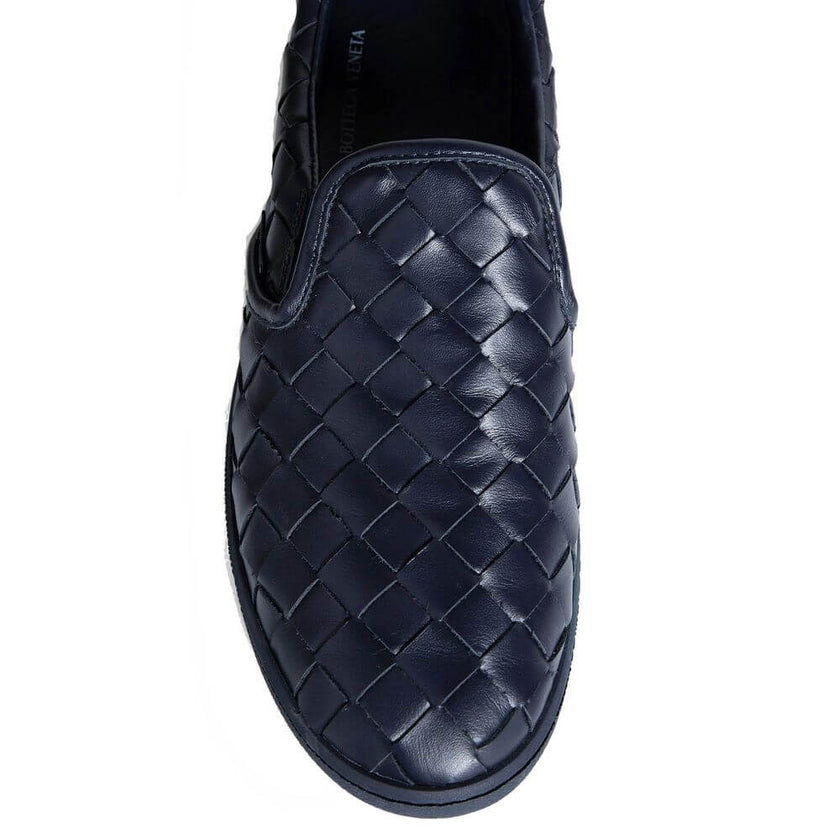 Blue Calfskin Low Top SneakersDescription: – Composition: 100% calf leather – Inner: Leather – Insole: Leather – Sole: Rubber – Round toe – Branded insole – Slip-on design – All-over Intrecciato – Made in Italy – Gender: MEN –Blue Calfskin Low Top Sneaker