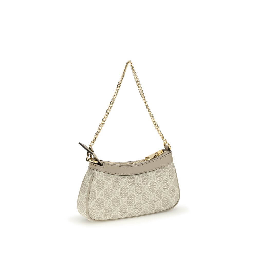 Ophidia Mini Shoulder BagOphidia Mini Shoulder Bag by Gucci is an elegant accessory in beige and white GG Supreme fabric with beige leather trim that accentuates its sophistication. Gold-tone hardware and the Double G logo add a distinctive and luxurious
