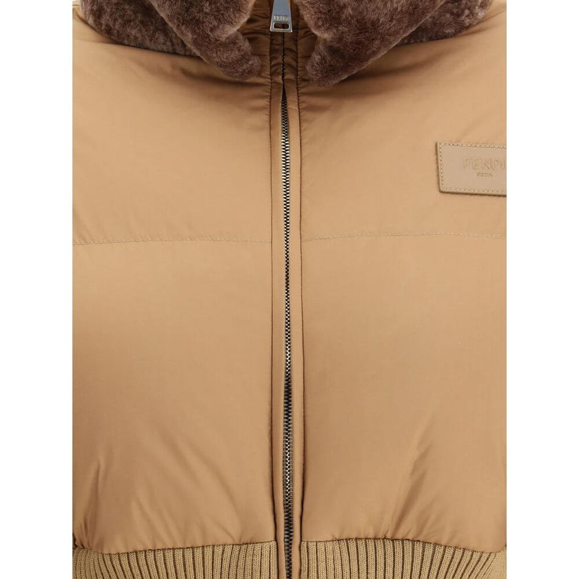 Brown Polyester Full-Length JacketThe Fendi cropped Down Jacket redefines winter outerwear with a contemporary elegance. Quilted padding and a high collar ensure warmth and protection, while the ribbed knit waistband in a tone-on-tone finish sculpts the s
