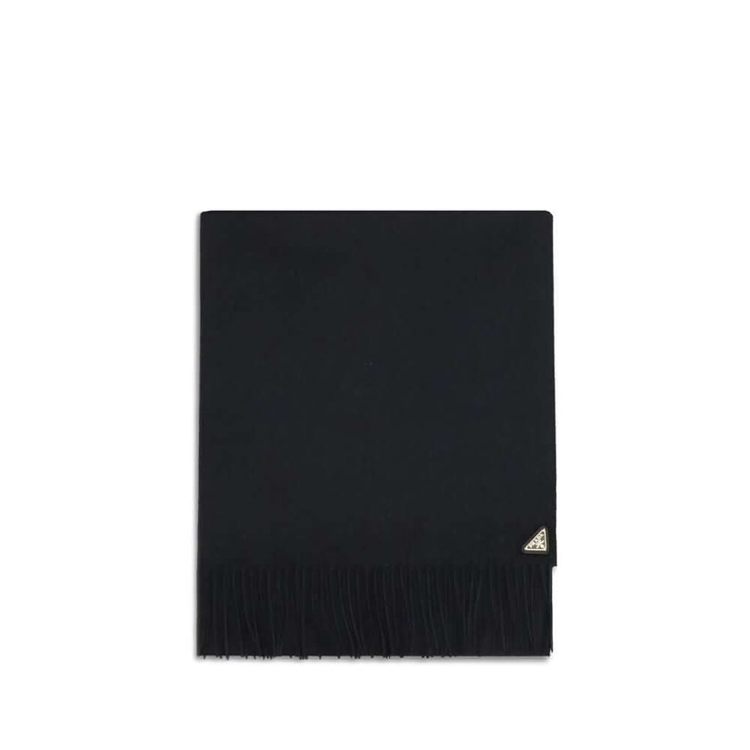 Silk and cashmere ScarfThe silk and cashmere Scarf by Prada is an elegant and lightweight accessory, perfect for adding a touch of sophistication to any look. Finished with frayed edges, it is embellished with the characteristic enameled metal logo triang