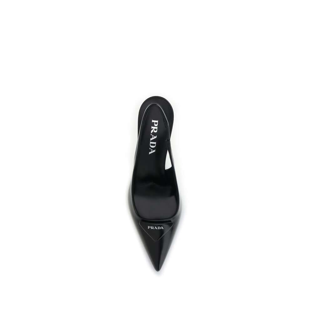 Black Leather High Heel PumpsThe leather slingback Pumps by Prada express contemporary elegance with clean lines and iconic details. Made of smooth leather, they are embellished with the classic tonal leather triangle logo on the front. The pointed toe mo