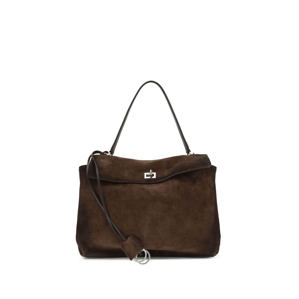 Brown Calf Leather Bos Taurus Shoulder BagThe Medium Rodeo Bag by Balenciaga blends sophistication and practicality with its combination of waxed suede calfskin and smooth leather. It features a top handle and a detachable shoulder strap for versatile car