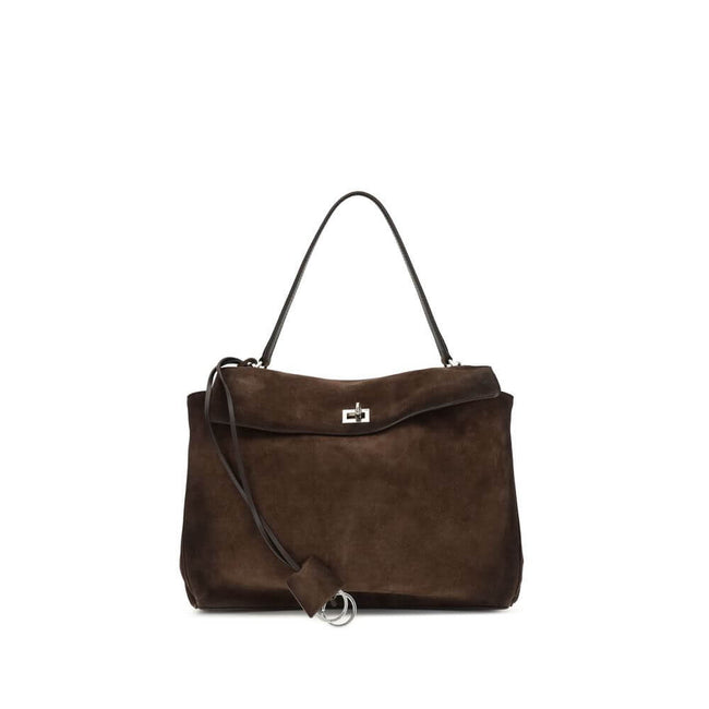 Brown Calf Leather Bos Taurus Shoulder BagThe Medium Rodeo Bag by Balenciaga blends sophistication and practicality with its combination of waxed suede calfskin and smooth leather. It features a top handle and a detachable shoulder strap for versatile car