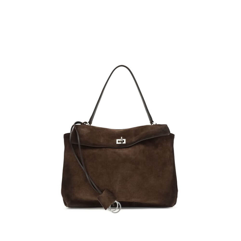 Brown Calf Leather Bos Taurus Shoulder BagThe Medium Rodeo Bag by Balenciaga blends sophistication and practicality with its combination of waxed suede calfskin and smooth leather. It features a top handle and a detachable shoulder strap for versatile car