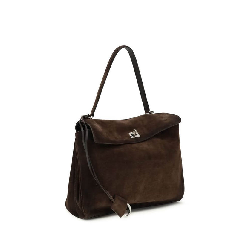 Brown Calf Leather Bos Taurus Shoulder BagThe Medium Rodeo Bag by Balenciaga blends sophistication and practicality with its combination of waxed suede calfskin and smooth leather. It features a top handle and a detachable shoulder strap for versatile car