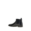 Black Leather Ankle BootsThe leather Ankle Boots by Prada reinterpret a wardrobe classic with essential lines and distinctive details. The upper is enriched with elastic side inserts and a rear pull-on for a quick and practical fit. The leather lining ens