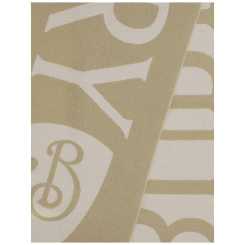 Beige Wool ScarfThe logo wool Scarf by Burberry is an accessory with a classic and distinctive style. Made in Italy, it features a two-tone design with Burberry lettering and a jacquard B Shield pattern, inspired by the iconic Equestrian Knight Design. Re