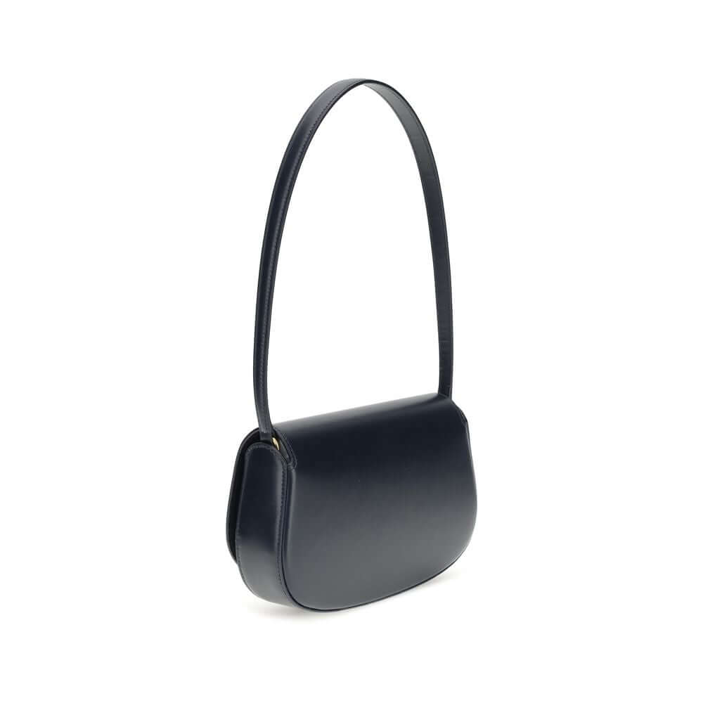 Blue Calf Leather Bos Taurus Shoulder BagThe Voltaire mini Shoulder Bag by Saint Laurent is an elegant crescent-shaped bag crafted from calfskin with a lightly polished finish. Bronze-colored metallic parts add a warm, vintage touch, while the Cassandre m