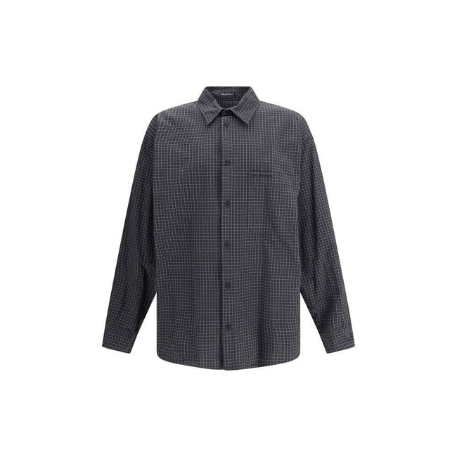 Black Wool Pattern ShirtThe oversized checked Shirt by Balenciaga is crafted from checked wool-blend flannel, reimagining a classic silhouette with a modern oversized cut. It features a button-down collar, seven front buttons engraved with Balenciaga, a c
