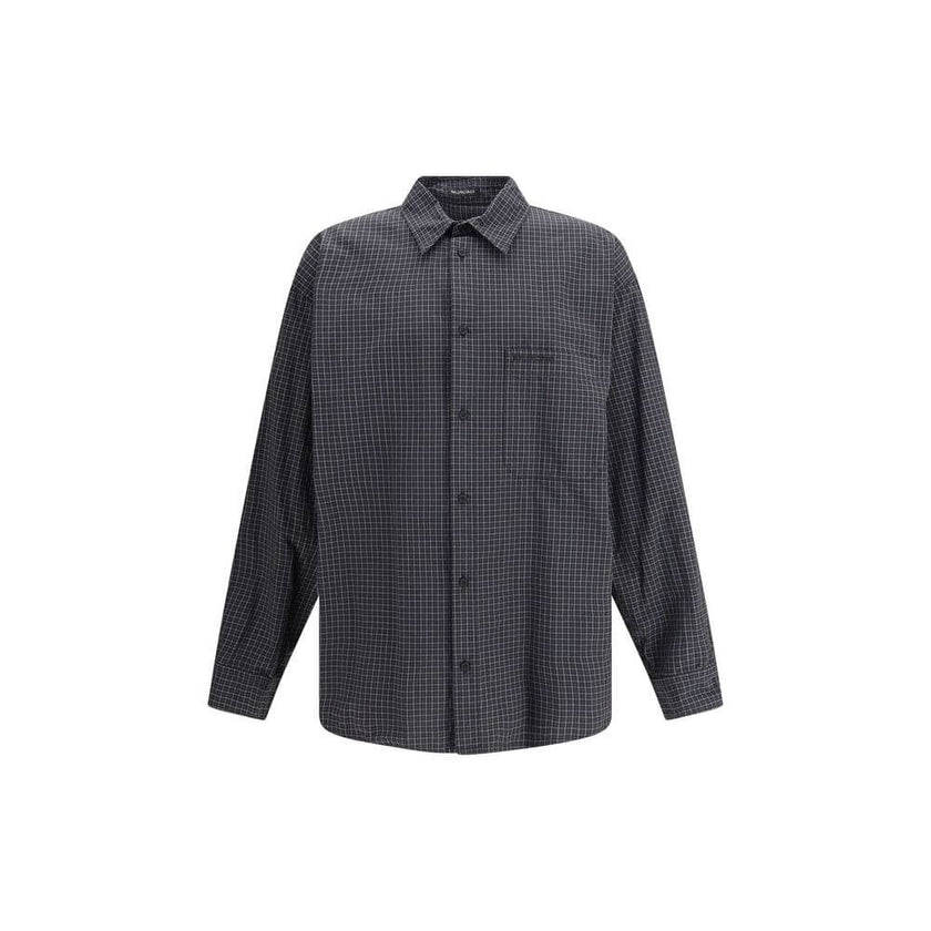 Black Wool Pattern ShirtThe oversized checked Shirt by Balenciaga is crafted from checked wool-blend flannel, reimagining a classic silhouette with a modern oversized cut. It features a button-down collar, seven front buttons engraved with Balenciaga, a c