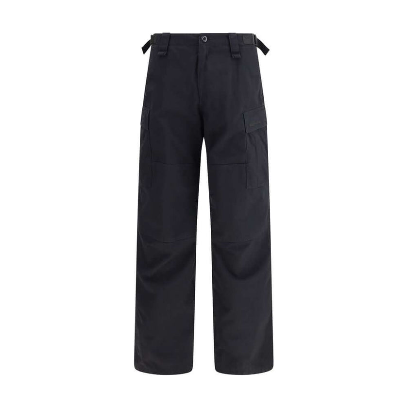 Black Cotton Cargo PantsThe Cargo Pants by Balenciaga represent the brand’s contemporary vision, where urban aesthetics meet the balance between form and function. Made of soft left-hand denim, they wrap with structure and comfort, defining a silhouette w