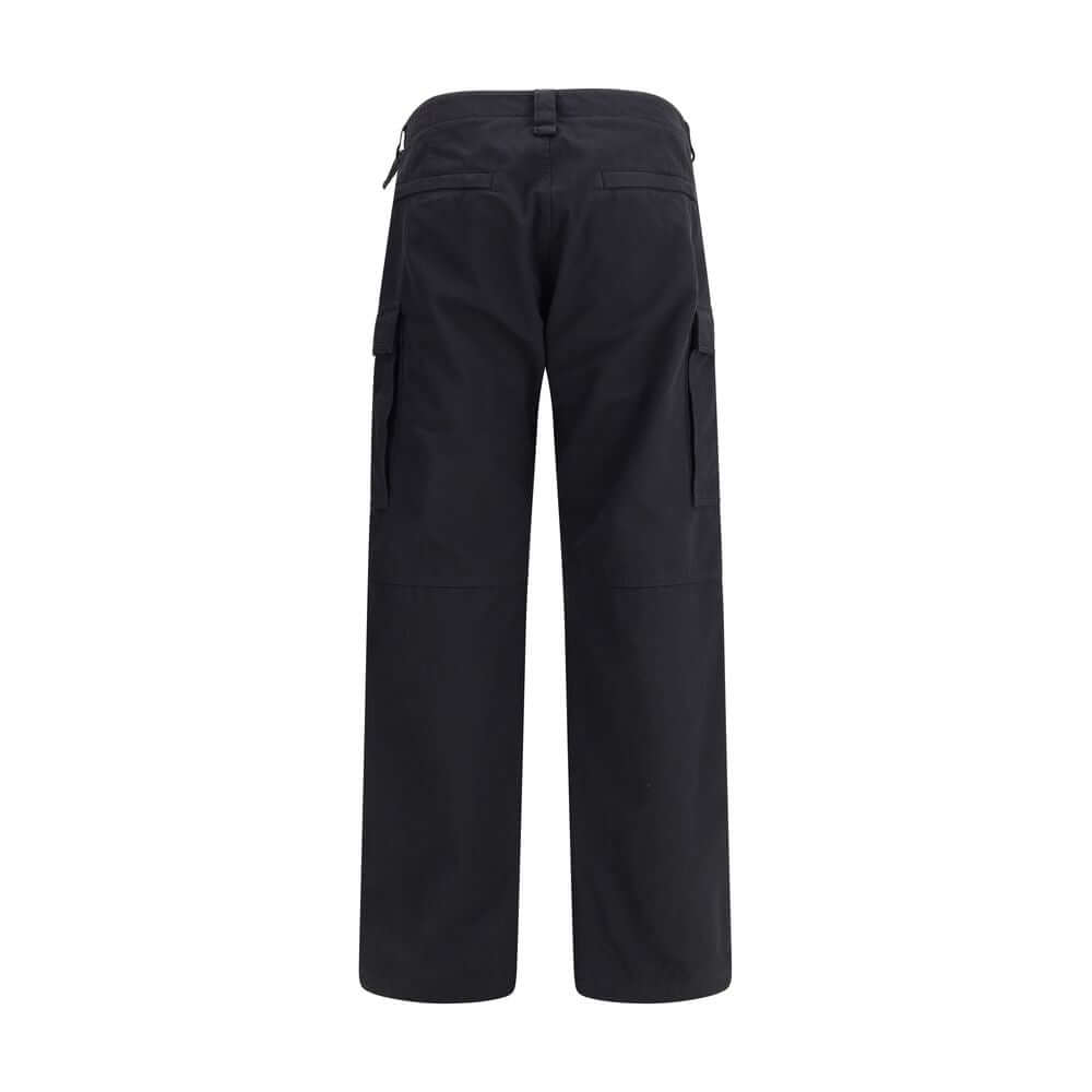 Black Cotton Cargo PantsThe Cargo Pants by Balenciaga represent the brand’s contemporary vision, where urban aesthetics meet the balance between form and function. Made of soft left-hand denim, they wrap with structure and comfort, defining a silhouette w