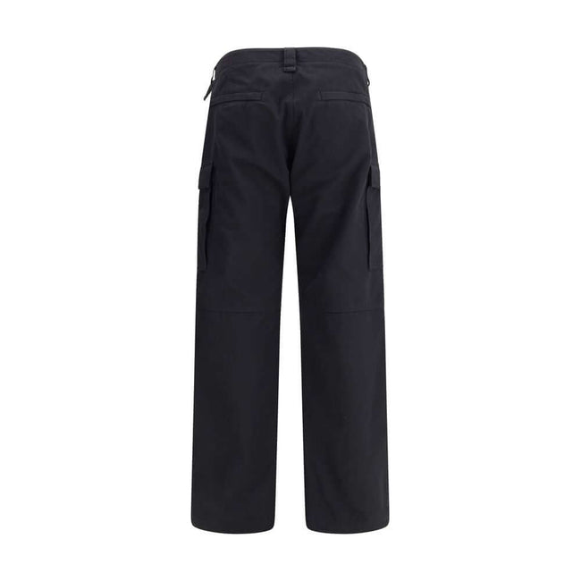 Black Cotton Cargo PantsThe Cargo Pants by Balenciaga represent the brand’s contemporary vision, where urban aesthetics meet the balance between form and function. Made of soft left-hand denim, they wrap with structure and comfort, defining a silhouette w