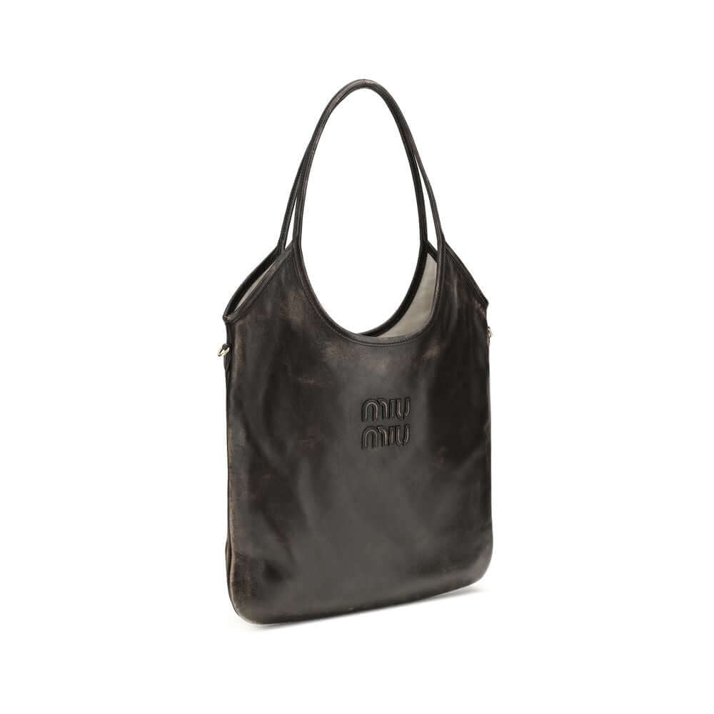 Brown Calf Leather Bos Taurus Shoulder BagIvy Shoulder Bag by Miu Miu made of soft, worn-effect leather features a double flat handle that allows comfortable shoulder carrying .The brand’s logo stands out on the front adding an iconic touch. The unlined i