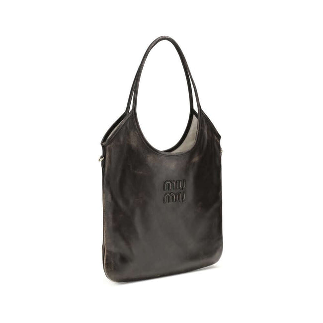Brown Calf Leather Bos Taurus Shoulder BagIvy Shoulder Bag by Miu Miu made of soft, worn-effect leather features a double flat handle that allows comfortable shoulder carrying .The brand’s logo stands out on the front adding an iconic touch. The unlined i