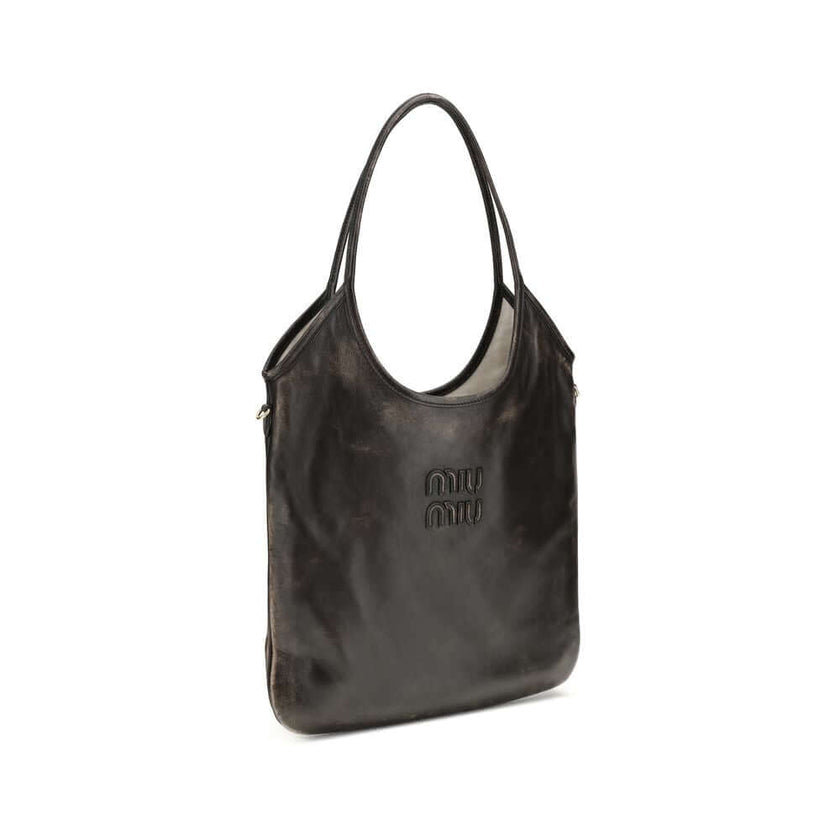Brown Calf Leather Bos Taurus Shoulder BagIvy Shoulder Bag by Miu Miu made of soft, worn-effect leather features a double flat handle that allows comfortable shoulder carrying .The brand’s logo stands out on the front adding an iconic touch. The unlined i