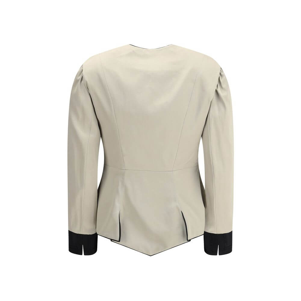 Silver Silk CoatThe Tailored Silk Jacket by Chloé reimagines classic elegance with refined details and a strong architectural touch. Its deep V-neckline is layered with a contrasting white placket, accentuated by gold-tone floral buttons for a luminous fi
