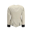 Silver Silk CoatThe Tailored Silk Jacket by Chloé reimagines classic elegance with refined details and a strong architectural touch. Its deep V-neckline is layered with a contrasting white placket, accentuated by gold-tone floral buttons for a luminous fi