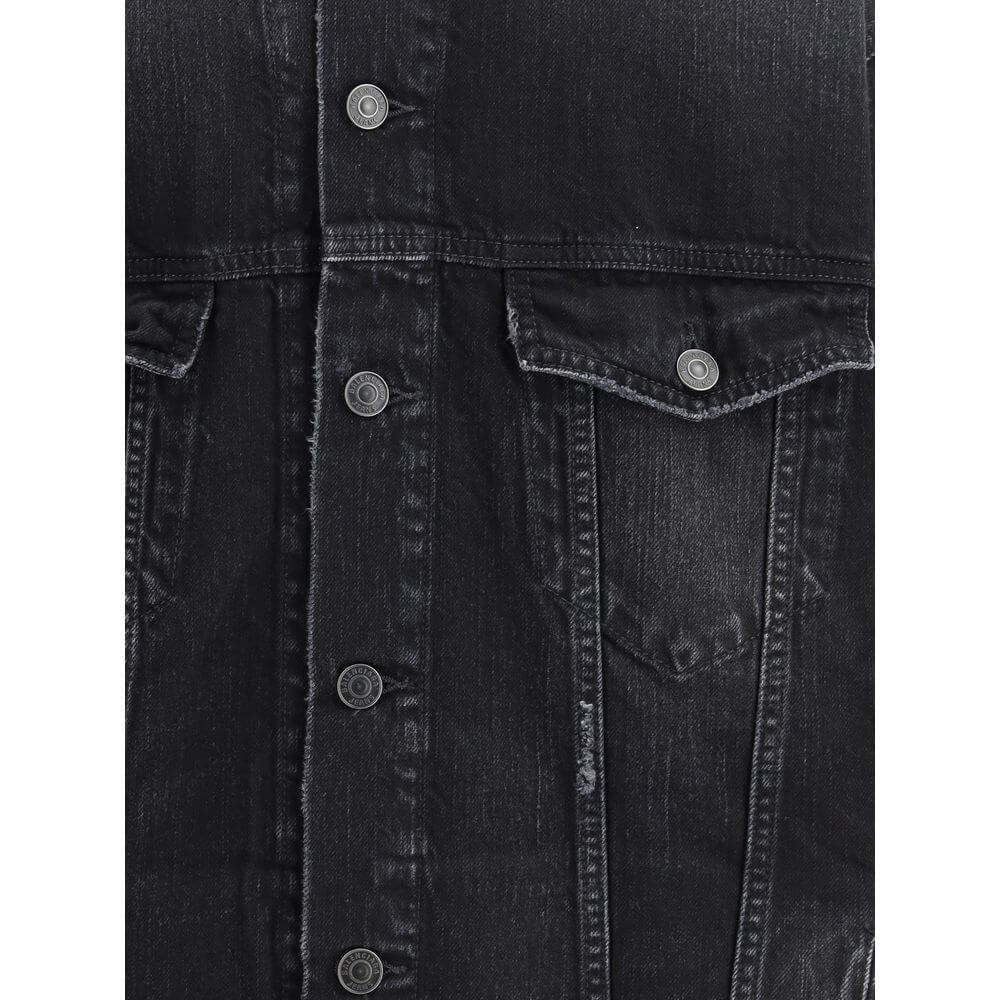 Black Cotton Denim JacketThe Layered Jacket by Balenciaga redefines layering with a modern twist. The front panel is crafted in denim, while the back and hood are made of soft sweatshirt fabric for a relaxed contrast. It features a classic collar, button-