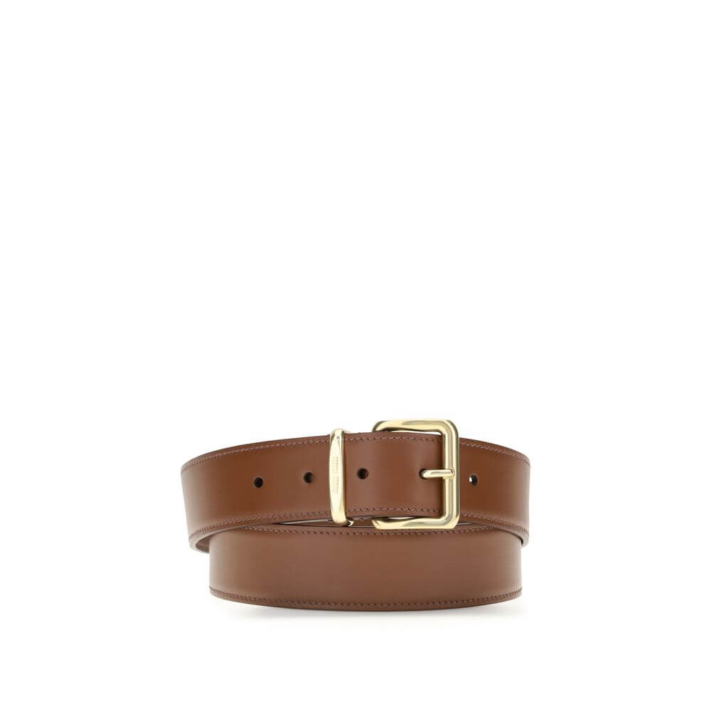Brown Calf Leather Bos Taurus Regular BeltLeather Belt by Miu Miu is an essential accessory with refined style. Made of smooth leather, it is embellished with a golden buckle with the iconic engraved logo, which adds a distinctive touch. With a thickness