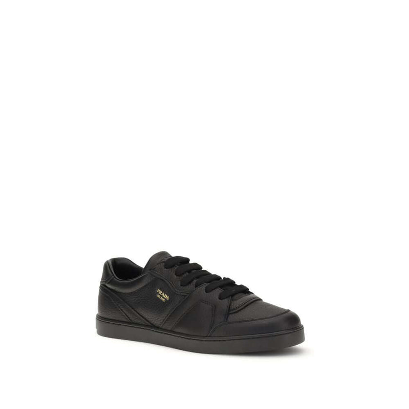 Black Calf Leather Bos Taurus SneakersLeather Sneakers by Prada combine elegance and urban style in an essential and sophisticated design. Featuring a lace-up closure and a flat sole, they feature a paneled pattern that adds depth to the profile. The gold