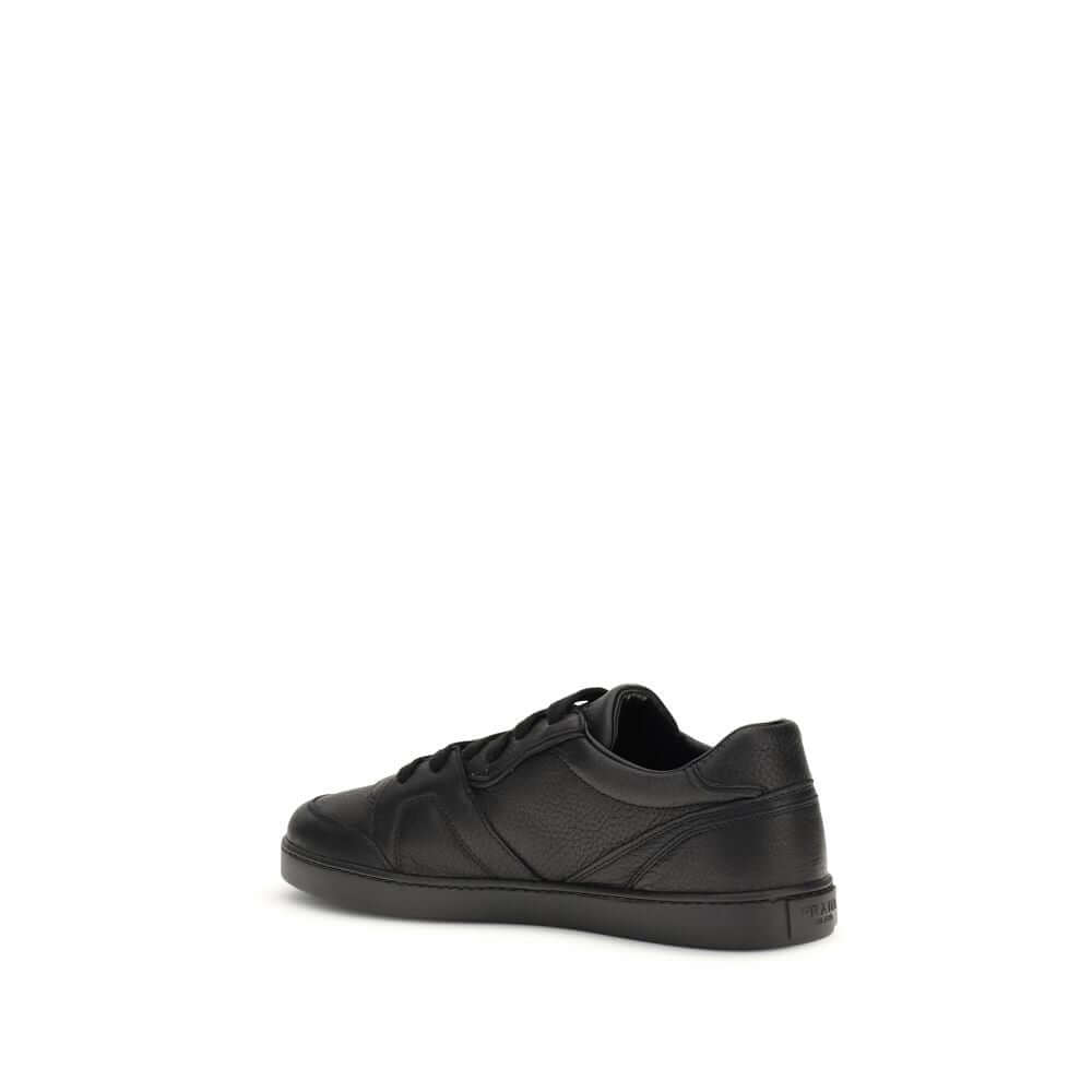 Black Calf Leather Bos Taurus SneakersLeather Sneakers by Prada combine elegance and urban style in an essential and sophisticated design. Featuring a lace-up closure and a flat sole, they feature a paneled pattern that adds depth to the profile. The gold