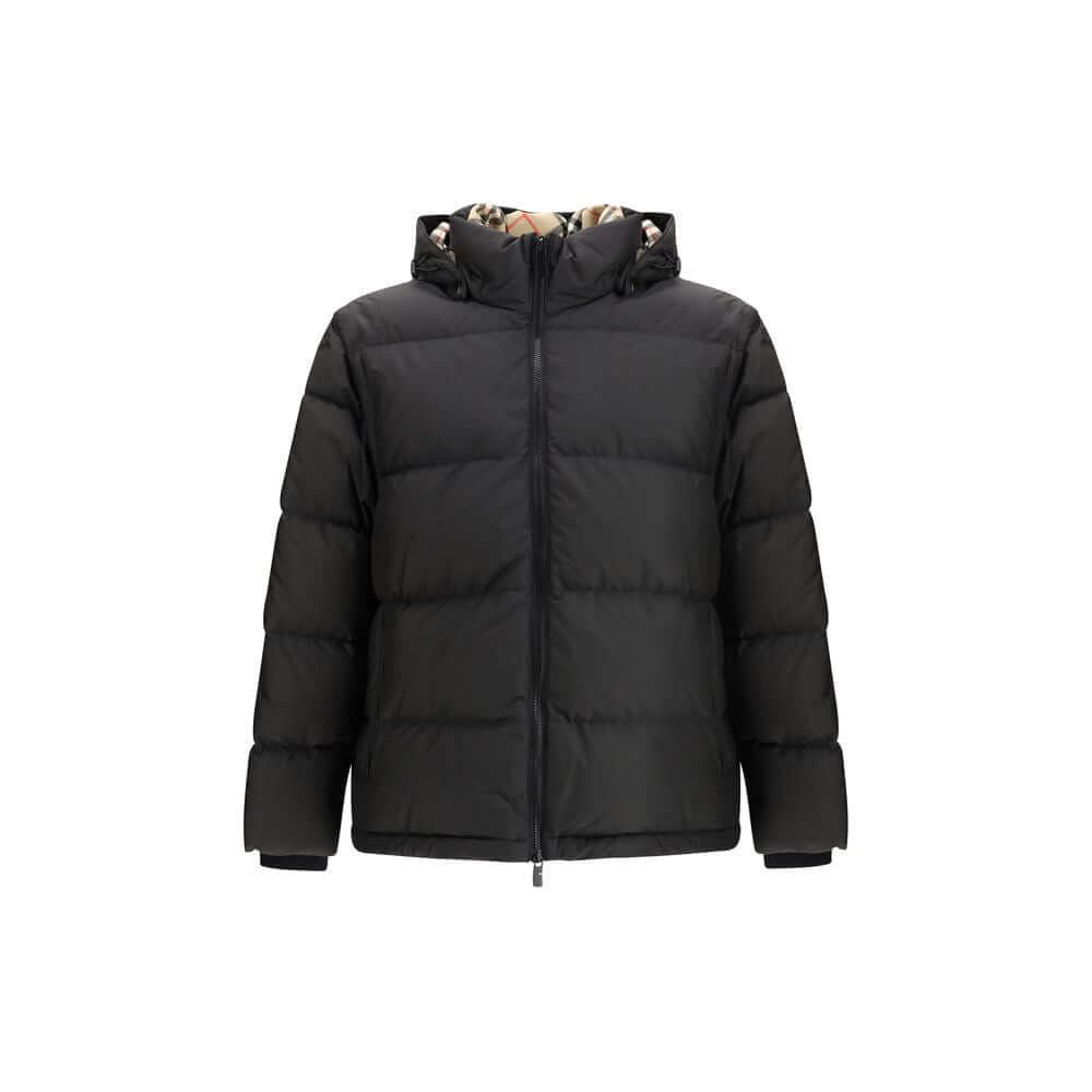 Black Polyester ClothingThe Puffer Jacket by Burberry merges technical innovation with timeless heritage. Filled with goose down and insulating fibres, it offers warmth and lightness in equal measure. Detachable sleeves transform the piece into a gilet, e