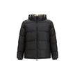 Black Polyester ClothingThe Puffer Jacket by Burberry merges technical innovation with timeless heritage. Filled with goose down and insulating fibres, it offers warmth and lightness in equal measure. Detachable sleeves transform the piece into a gilet, e